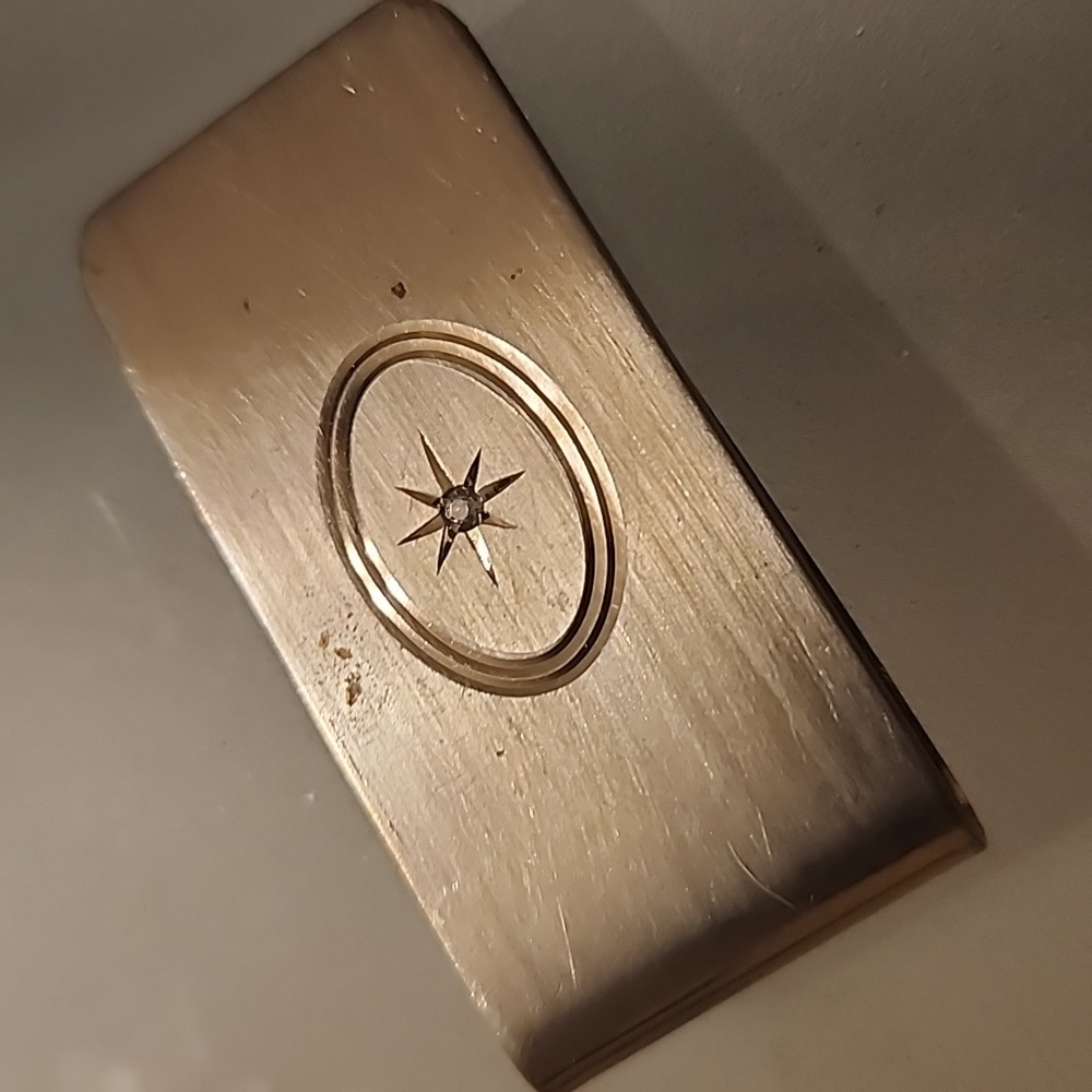 Goldtone  Money Clip With A Diamond Like Stone.